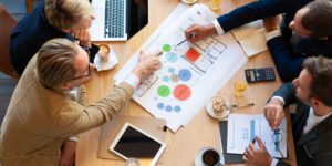 Business team analyzing charts together during a strategy meeting